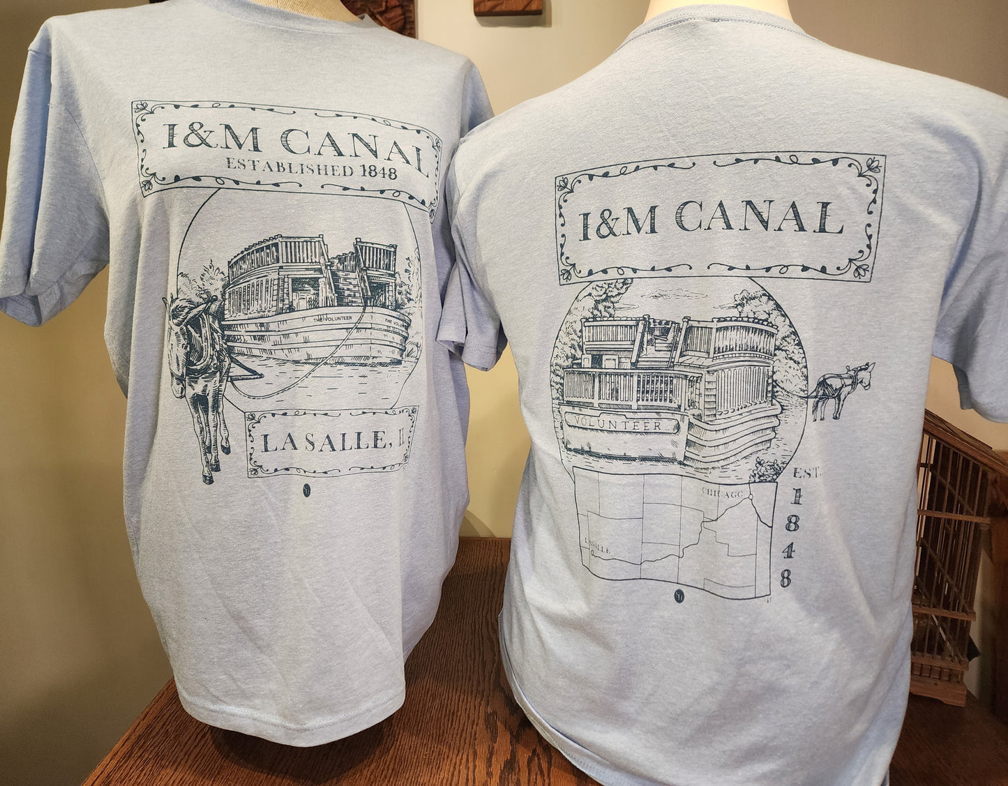I&M Canal "Larry and the Volunteer" Next-Level tee, Heather Colombia Blue or Sand SM-3X