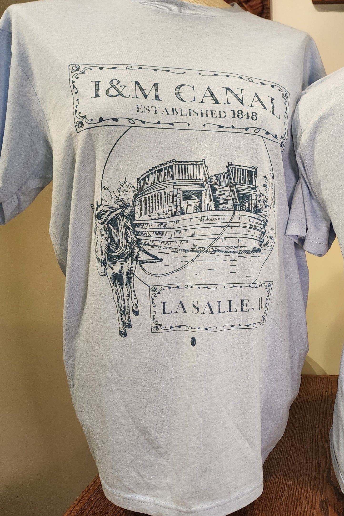 I&M Canal "Larry and the Volunteer" Next-Level tee, Heather Colombia Blue or Sand SM-3X