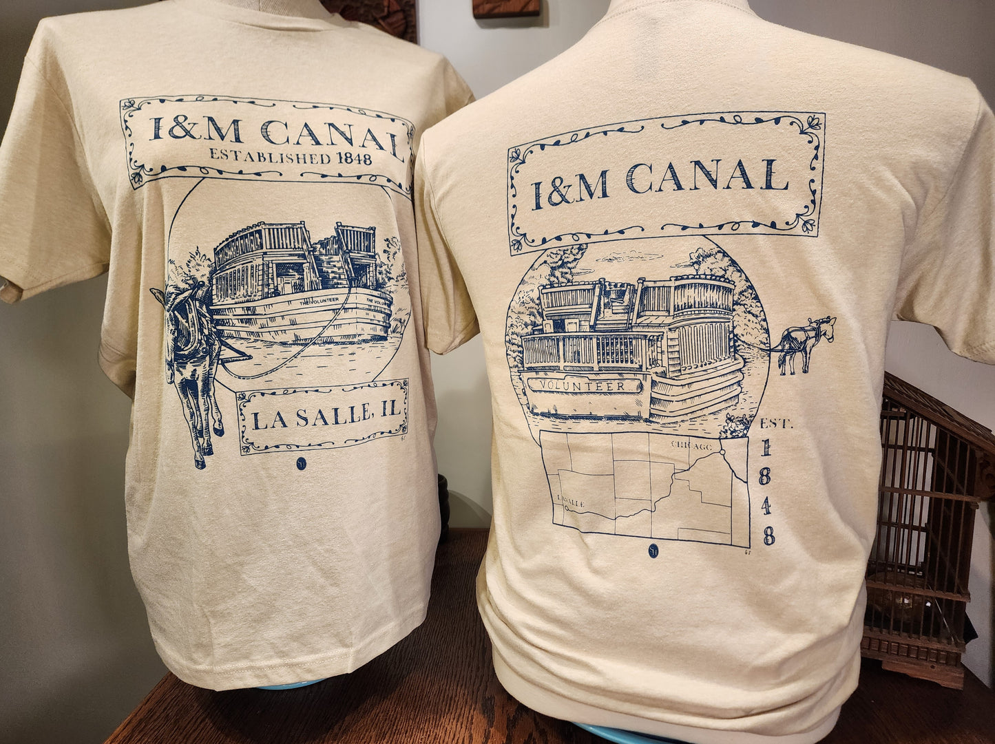 I&M Canal "Larry and the Volunteer" Next-Level tee, Heather Colombia Blue or Sand SM-3X